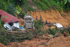Search resumes for 12 missing in Malaysia landslide