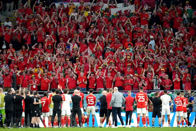 Wales players applaud the travelling supporters following their World Cup exit (Nick Potts/PA)