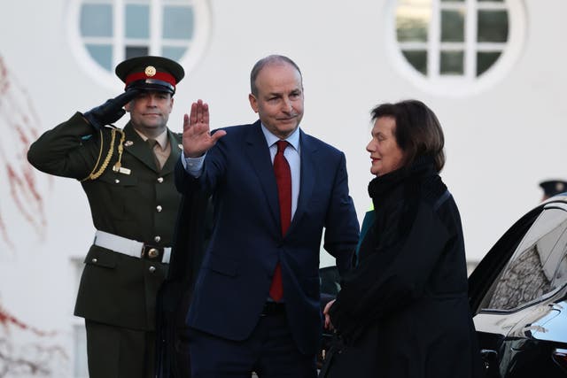 Taoiseach Micheal Martin and Mary Martin arrive at Aras an Uachtarain in Dublin to tender his resignation to President of Ireland Michael D Higgins. Leo Varadkar takes over as taoiseach under the terms of a coalition deal struck in 2020. Picture date: Saturday December 17, 2022.
