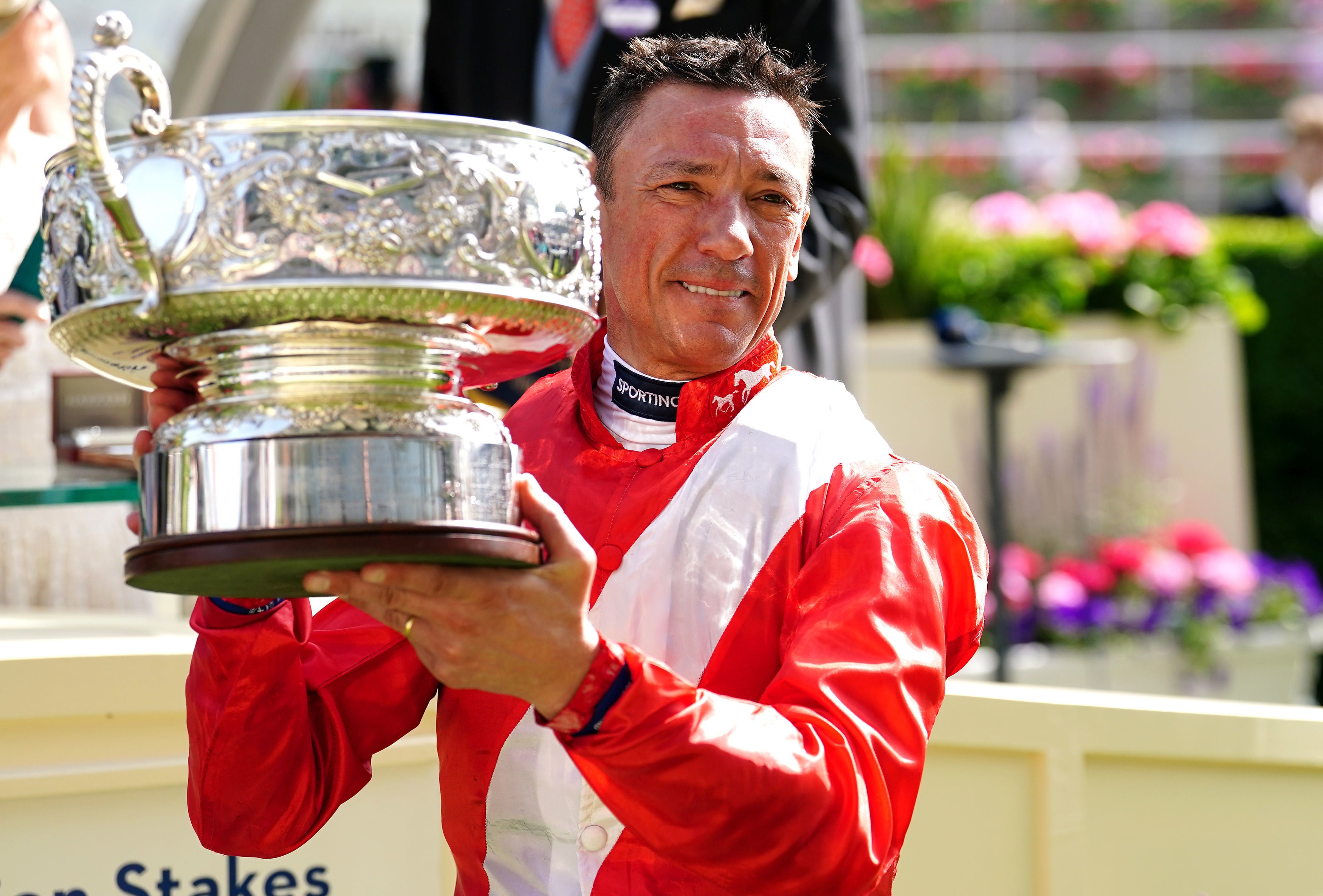 Jockey Frankie Dettori celebrates with the trophy after winning the Coronation Stakes with horse Inspiral during day four of Royal Ascot