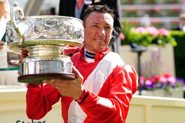<p>Jockey Frankie Dettori celebrates with the trophy after winning the Coronation Stakes with horse Inspiral during day four of Royal Ascot</p>