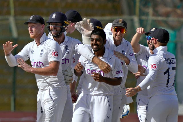 England’s Rehan Ahmed, centre, celebrates with his team-mates after taking the wicket of Pakistan’s Saud Shakeel (Fareed Khan/AP).