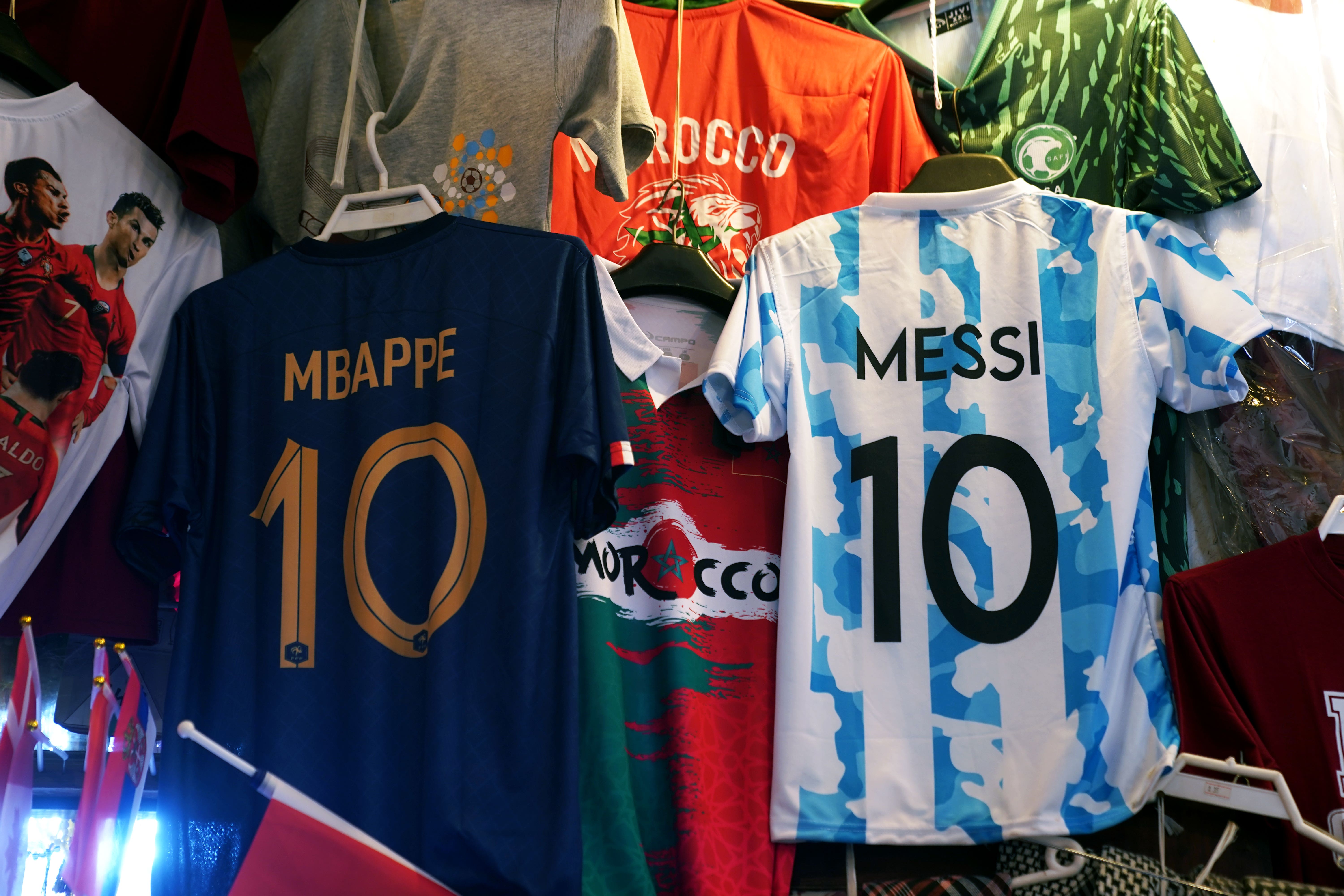 A France and Argentina shirt hang in a market stall in the Souq area of Doha. Reigning champions France will play Argentina in Sunday?s World Cup final. Picture date: Saturday December 17, 2022.