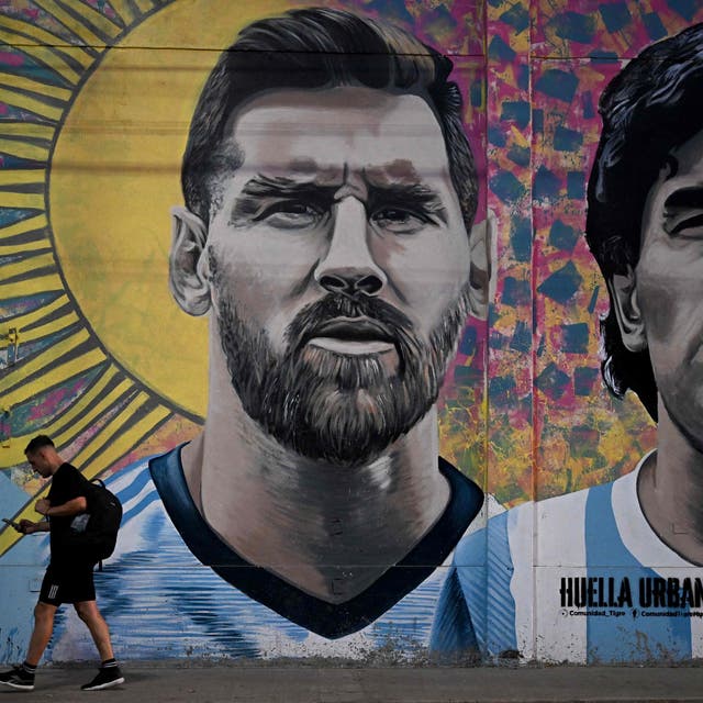 <p>A mural in Buenos Aires depicting Argentina icons Lionel Messi and Diego Maradona</p>