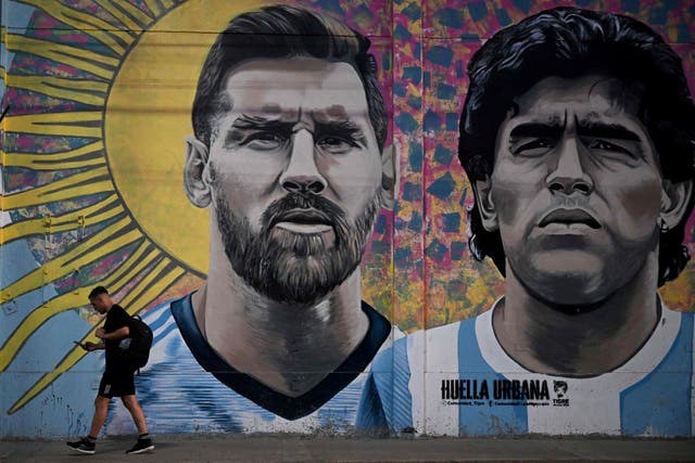 <p>A mural in Buenos Aires depicting Argentina icons Lionel Messi and Diego Maradona</p>