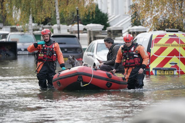 <p>Emergency services rescue resident Stefano Calcagni and his friend’s dogs Batista and Pandora on Belsize Road in Camden</p>