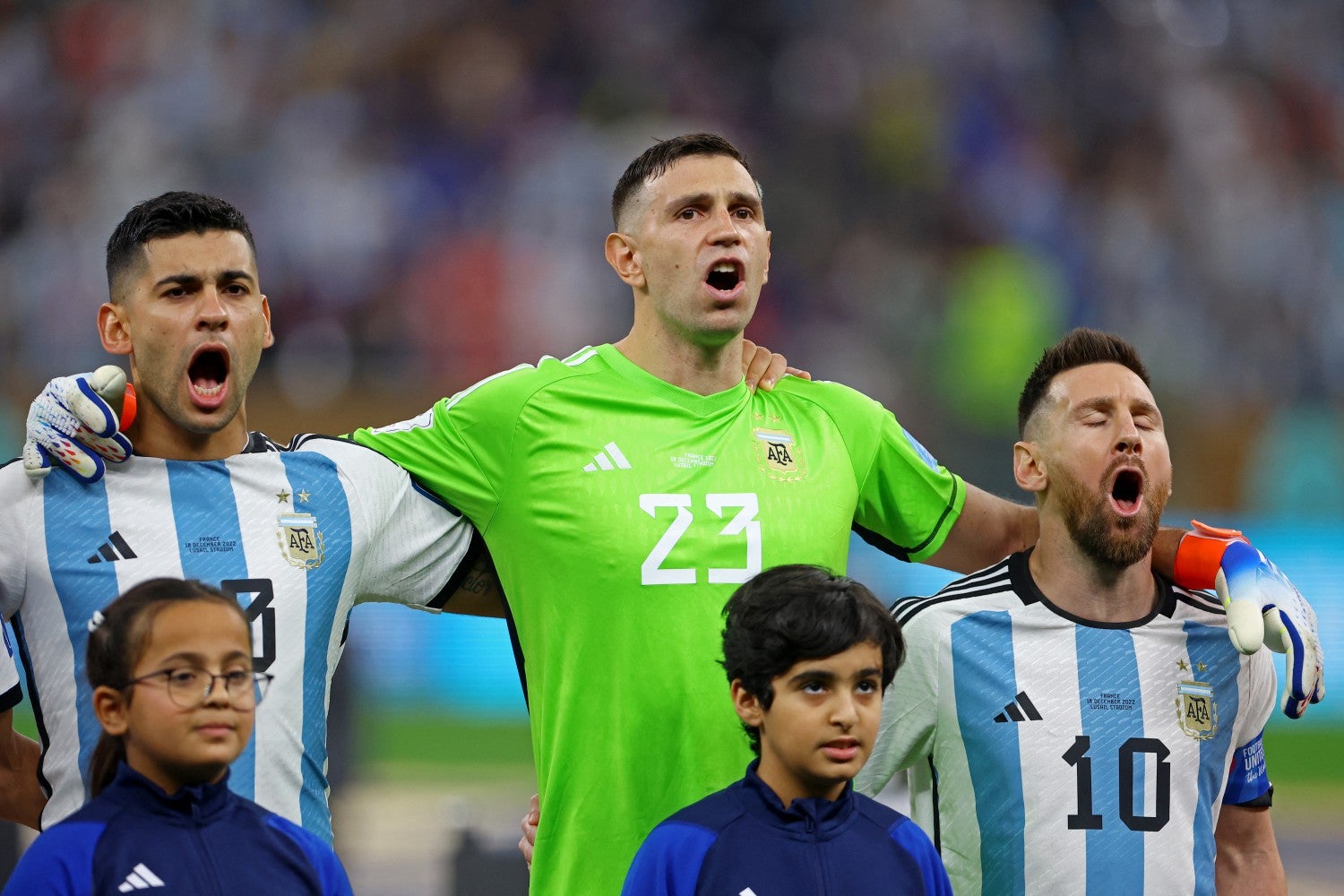 Cristian Romero, Emiliano Martinez and Lionel Messi sing the Argentine national anthem