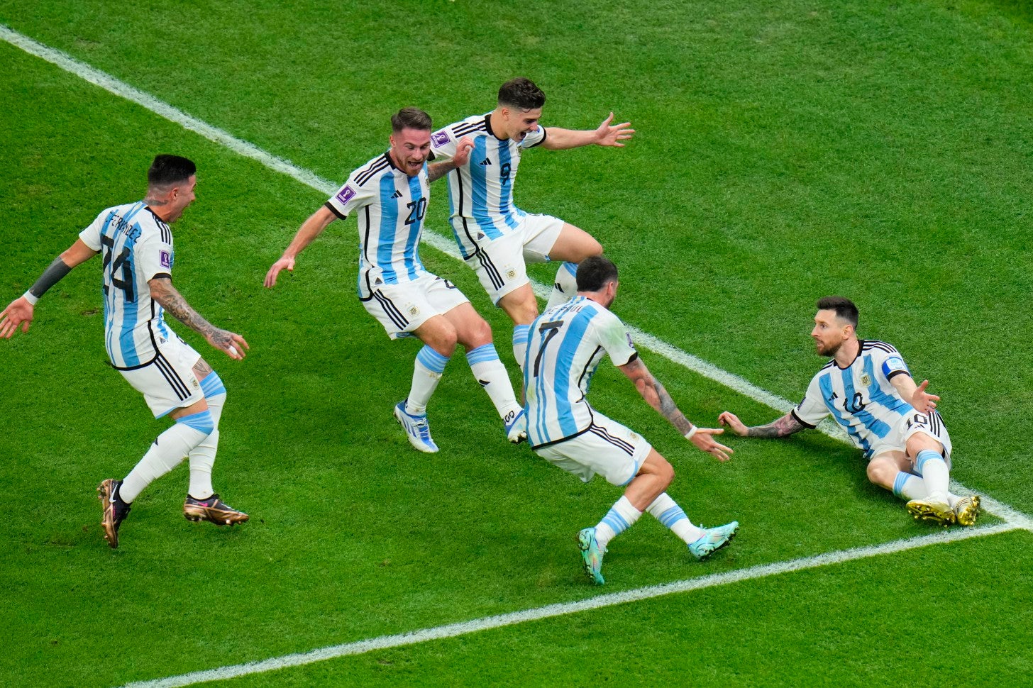 Players surround Messi after he scored