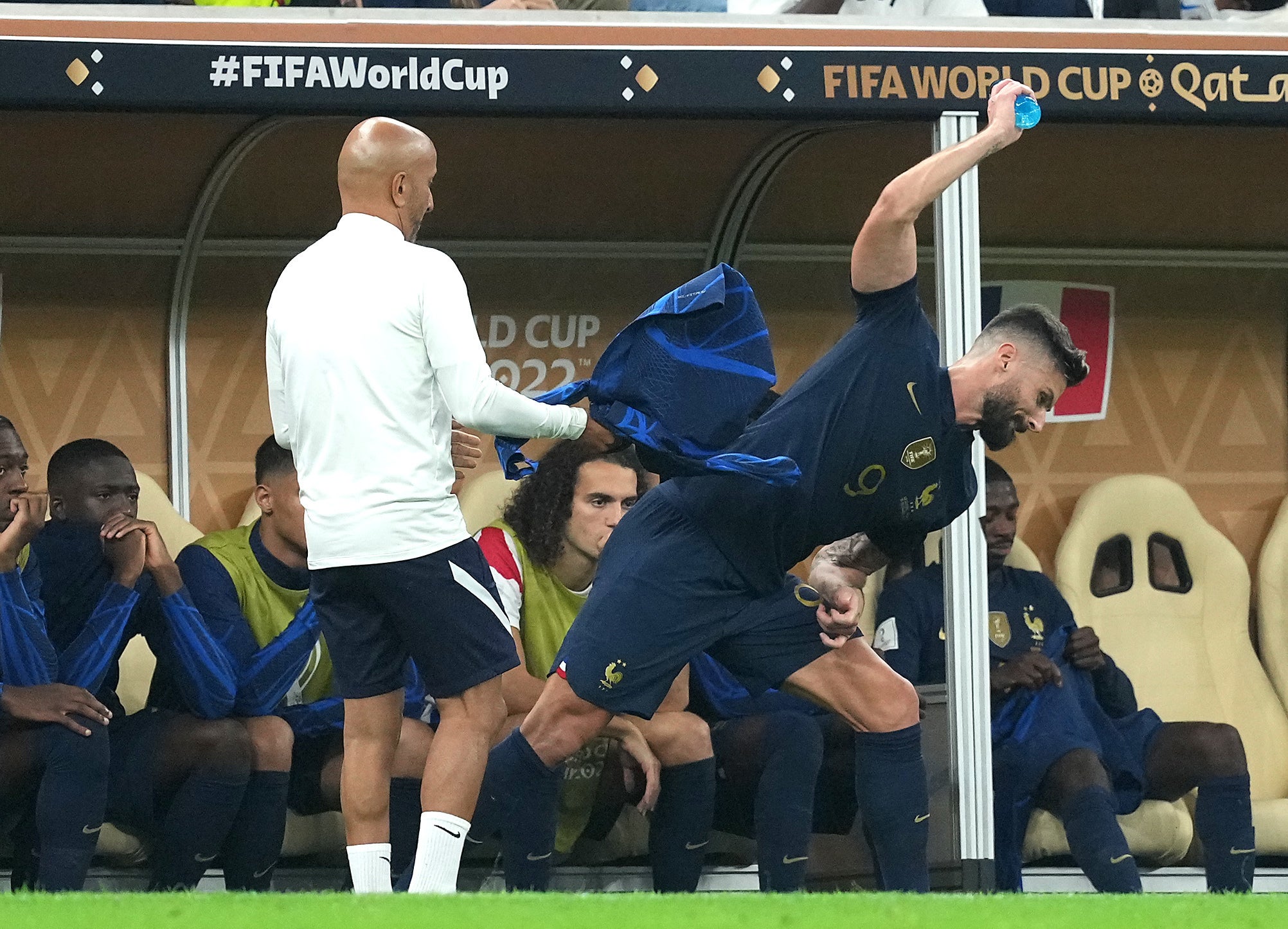 Giroud throwing a bottle after being substituted off