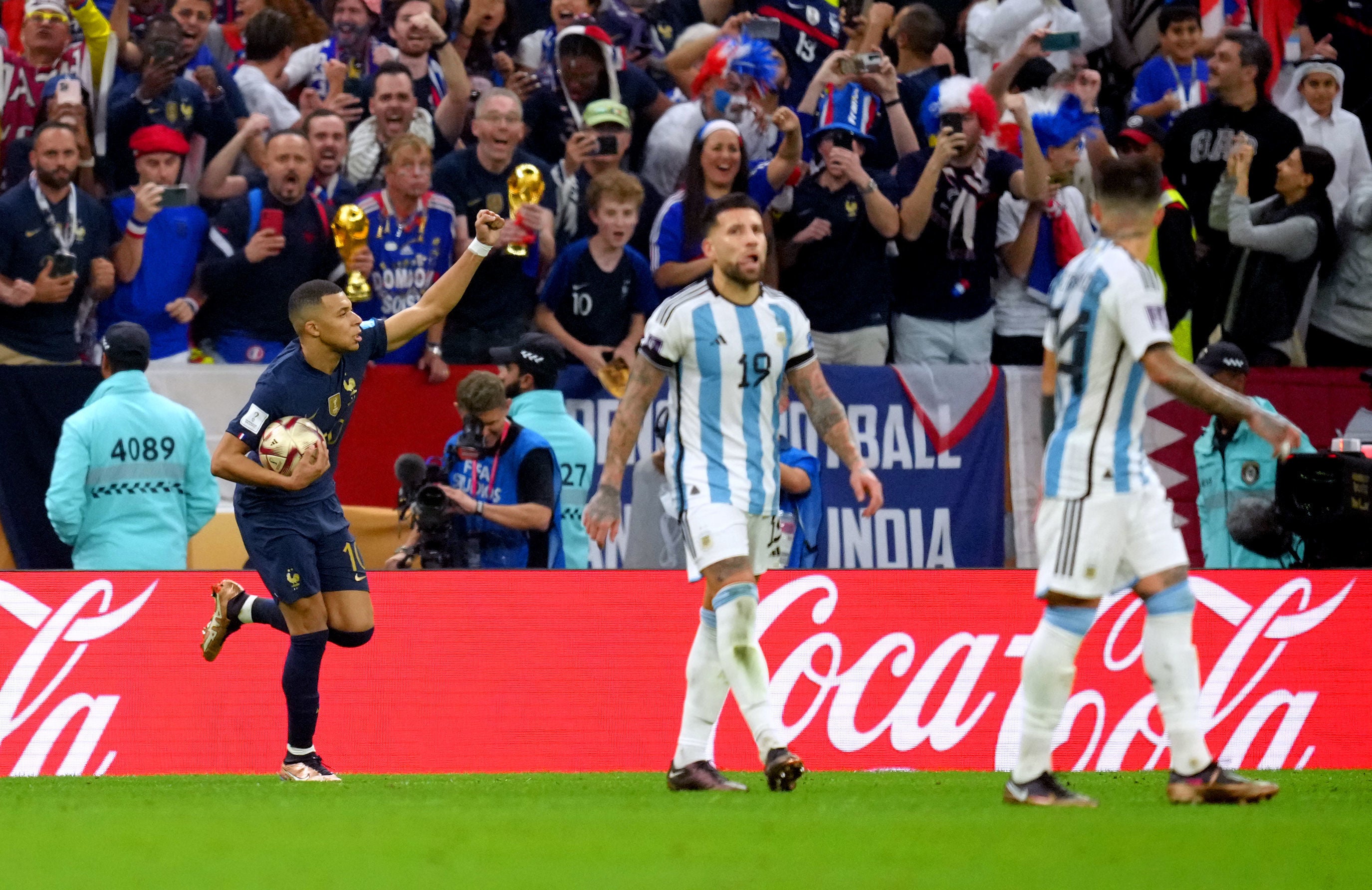 Argentina players look dejected as Mbappe celebrates scoring France’s first goal