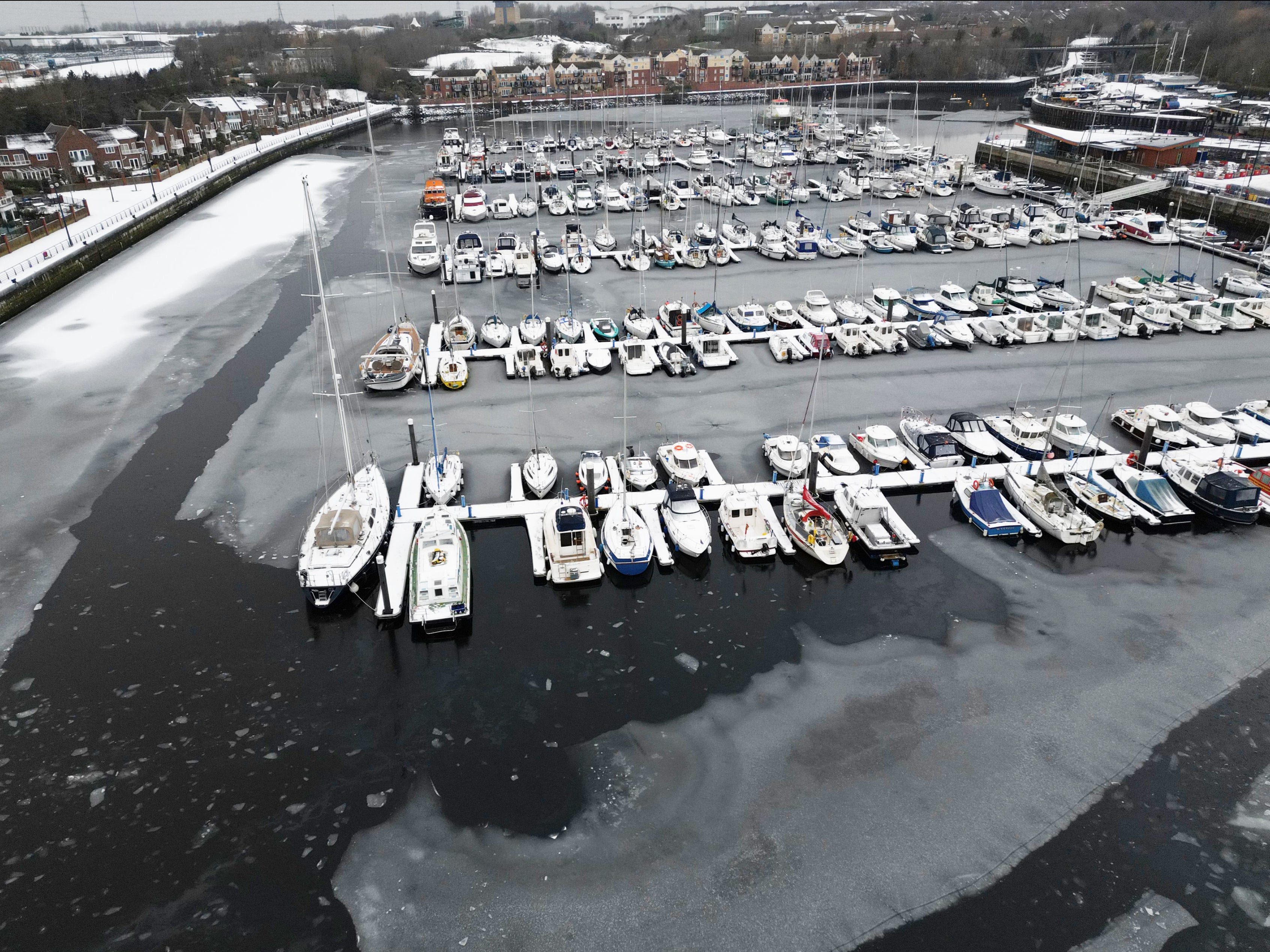 Boats sitting in the frozen Royal Quays Marina at North Shields on Sunday