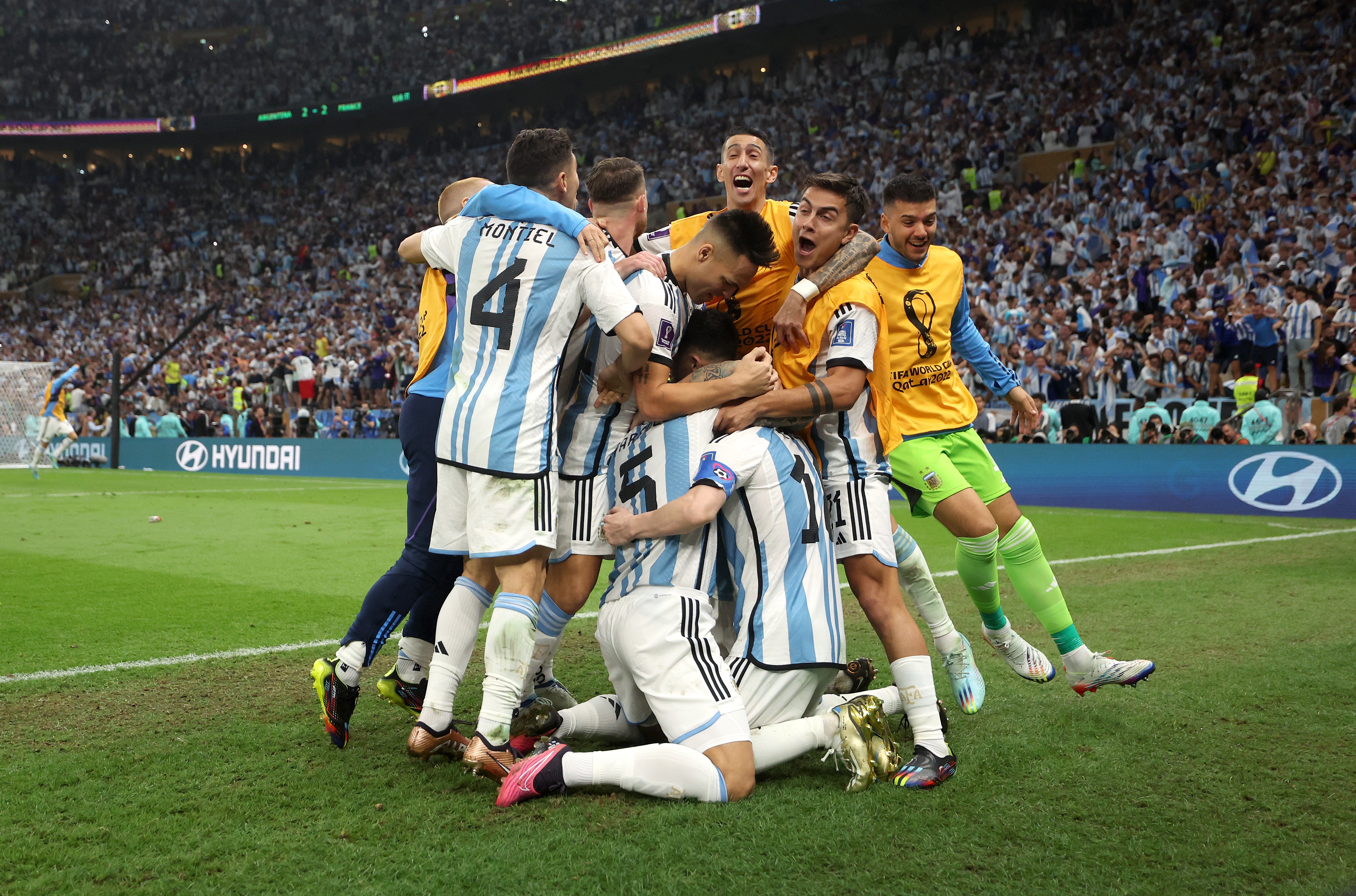 Argentina players celebrate their third