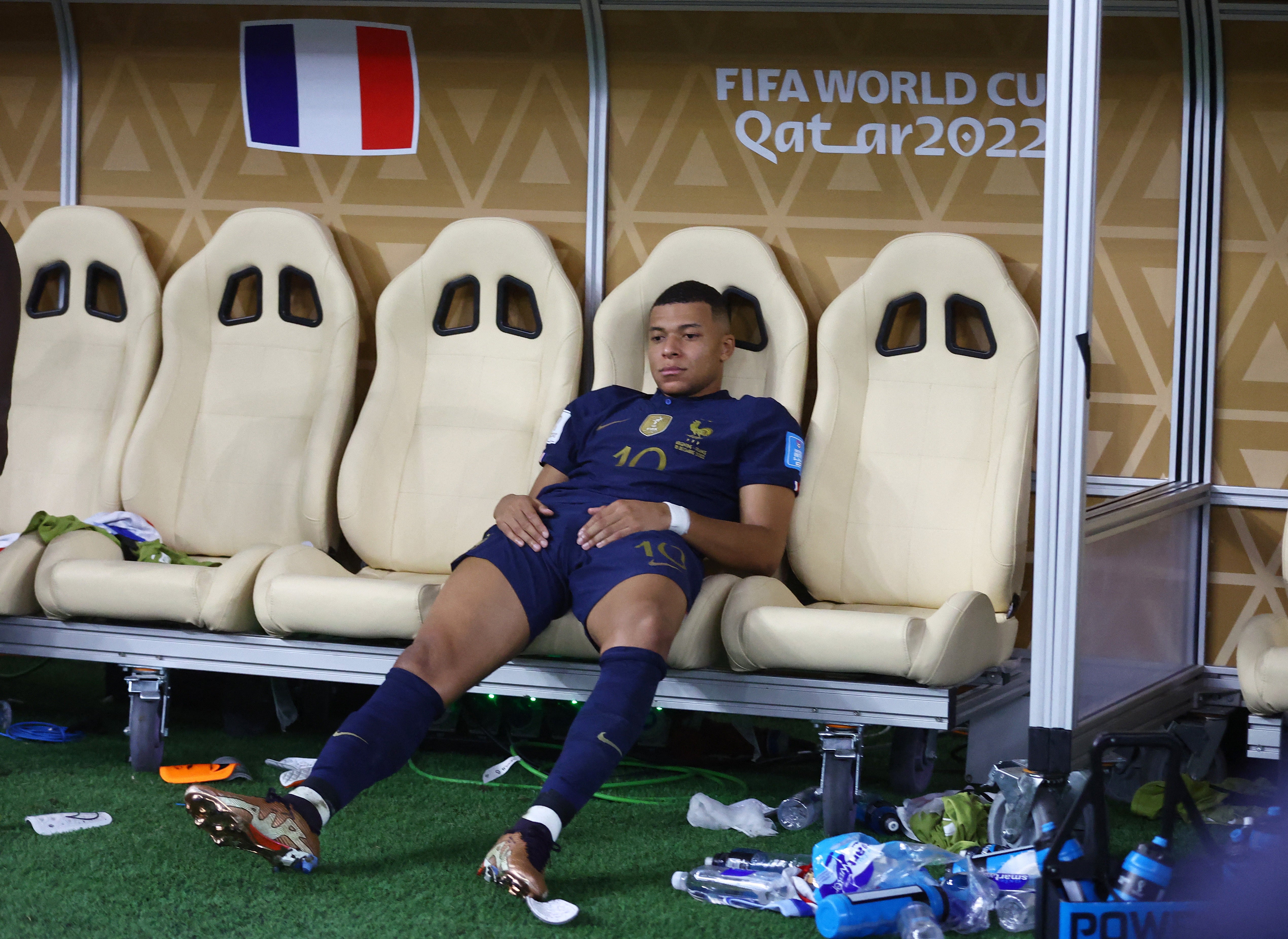 Mbappe sits in the dugout