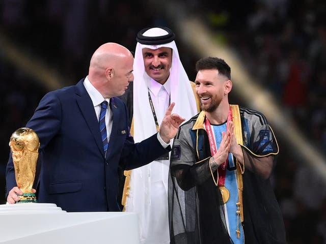 <p>Lionel Messi (right) with Fifa president Gianni Infantino (left) and the Emir of Qatar</p>