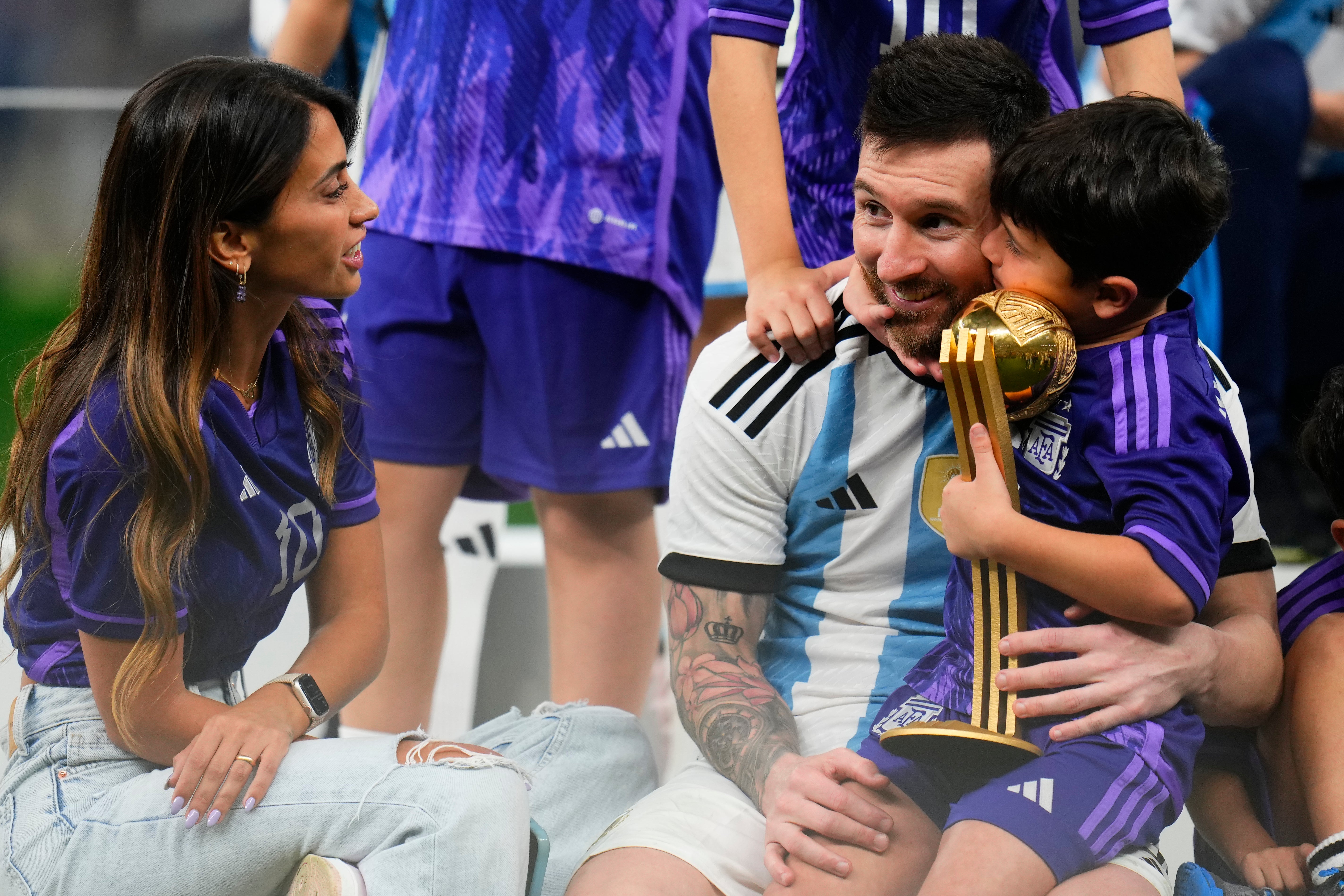 Lionel Messi celebrates with his family after winning the World Cup