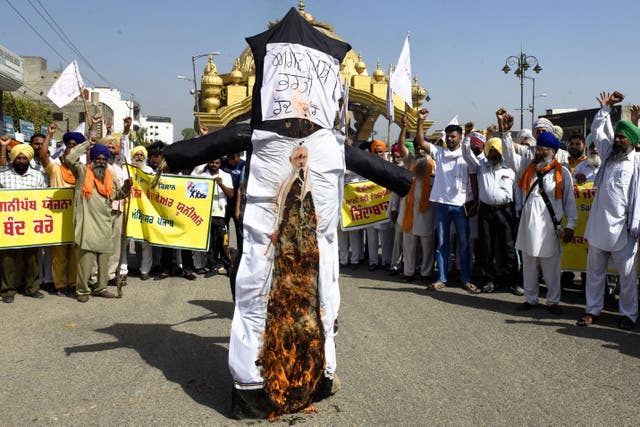 <p>FILE: Demonstrators shout slogans as they burn an effigy of India’s prime minister Narendra Modi during a protest against the government’s new ‘Agnipath’ recruitment scheme for the army, navy, and air forces on the outskirts of Amritsar on 24 June 2022</p>