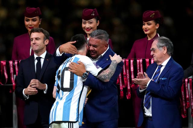 Argentina captain Lionel Messi hugs Claudio Tapia, president of the Argentina Football Association, after leading his side to victory in Qatar (Nick Potts/PA)