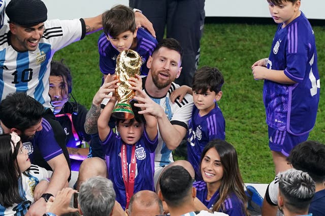 Argentina’s Lionel Messi sits with family members after the World Cup final (Adam Davy/PA)