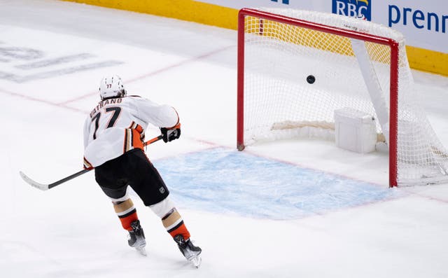 <p>File A player  scores on an empty net goal net during the final seconds of the third period of an NHL hockey game</p>