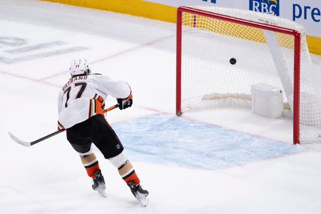 <p>File A player  scores on an empty net goal net during the final seconds of the third period of an NHL hockey game</p>