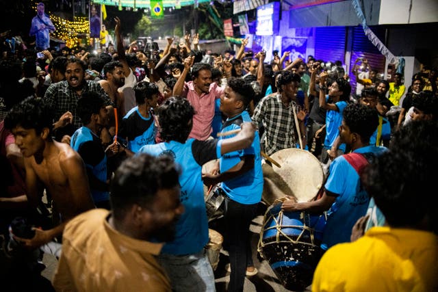 <p>Argentina fans in Kochi in India’s Kerala state, celebrate Argentina’s victory in the World Cup final soccer match between Argentina and France in Qatar, Sunday, 18 December 2022</p>