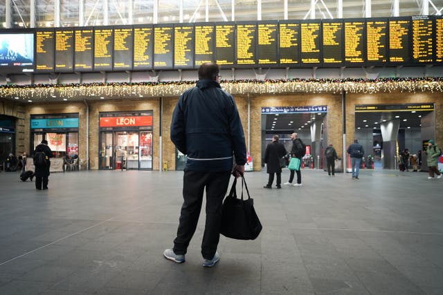 Strikes by railway workers will cause severe disruption to services on Christmas Eve, Network Rail has warned (James Manning/PA)