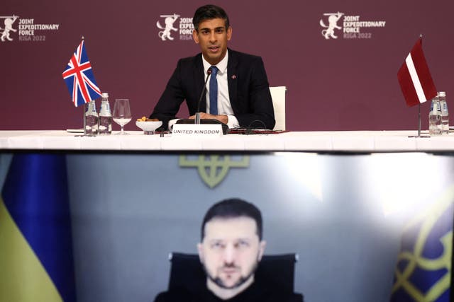 Ukrainian President Volodymyr Zelensky listens via video link as Prime Minister Rishi Sunak speaks during the Joint Expeditionary Force (JEF) summit in Riga, Latvia (Henry Nicholls/PA)