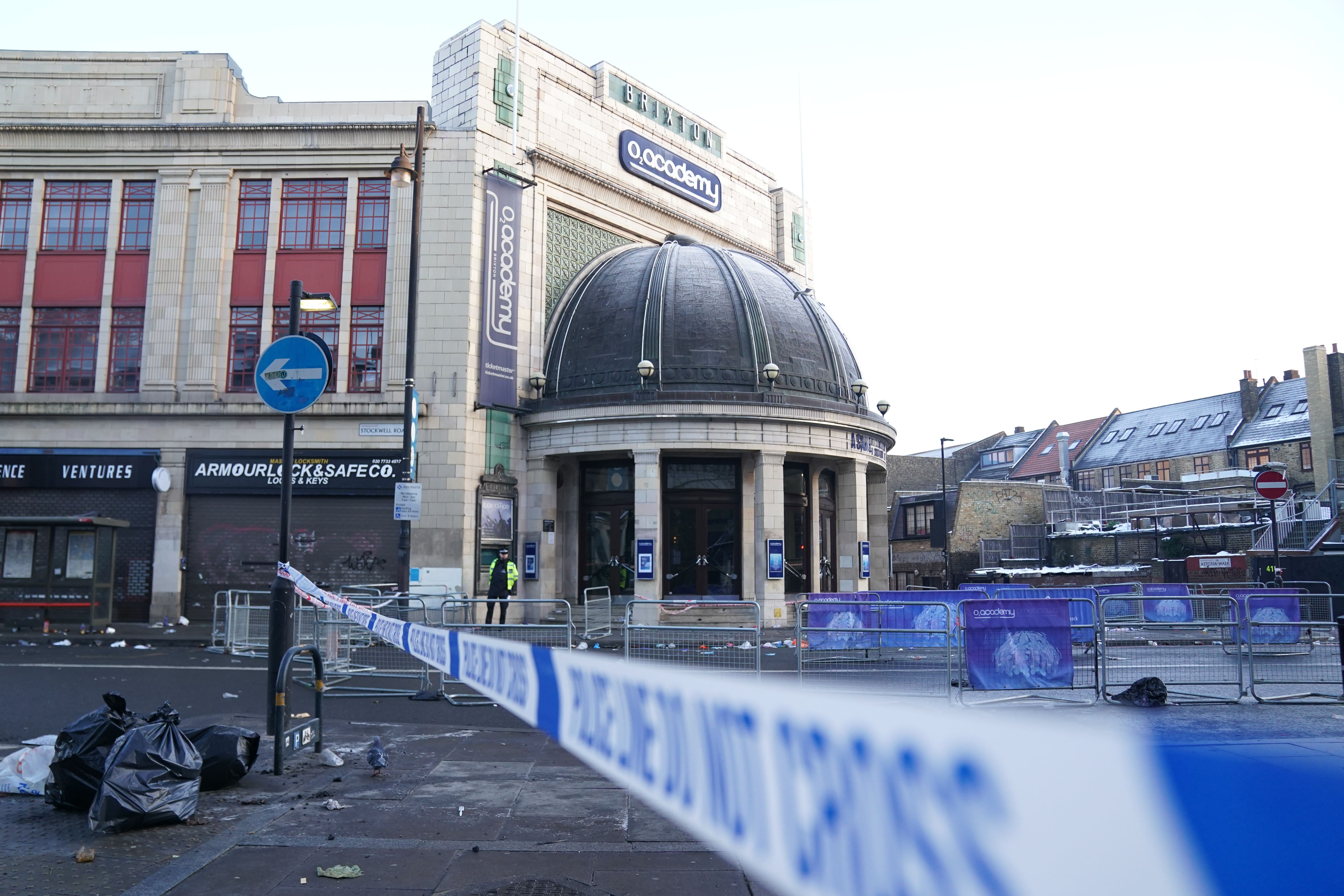 Two people died after a huge crowd built up outside the venue as a gig took place inside