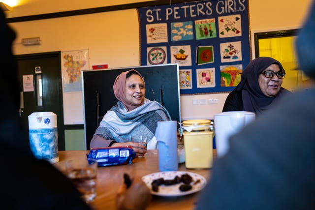 <p>Views of locals people enjoy tea and conversation at the St Peter's Community Well-being Project</p>
