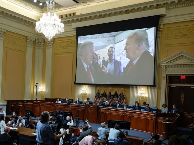 <p>A image of former President Donald Trump talking to his Chief of Staff Mark Meadows is displayed as Cassidy Hutchinson, a top former aide to Meadows, testifies</p>