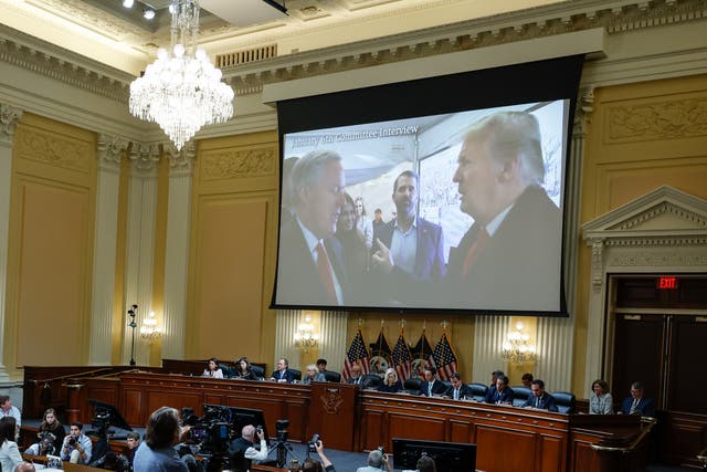 <p>A image of former President Donald Trump talking to his Chief of Staff Mark Meadows is displayed as Cassidy Hutchinson, a top former aide to Meadows, testifies</p>