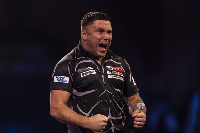 Gerwyn Price, pictured, came from behind to beat Luke Woodhouse 3-1 at the World Darts Championship (Steven Paston/PA)