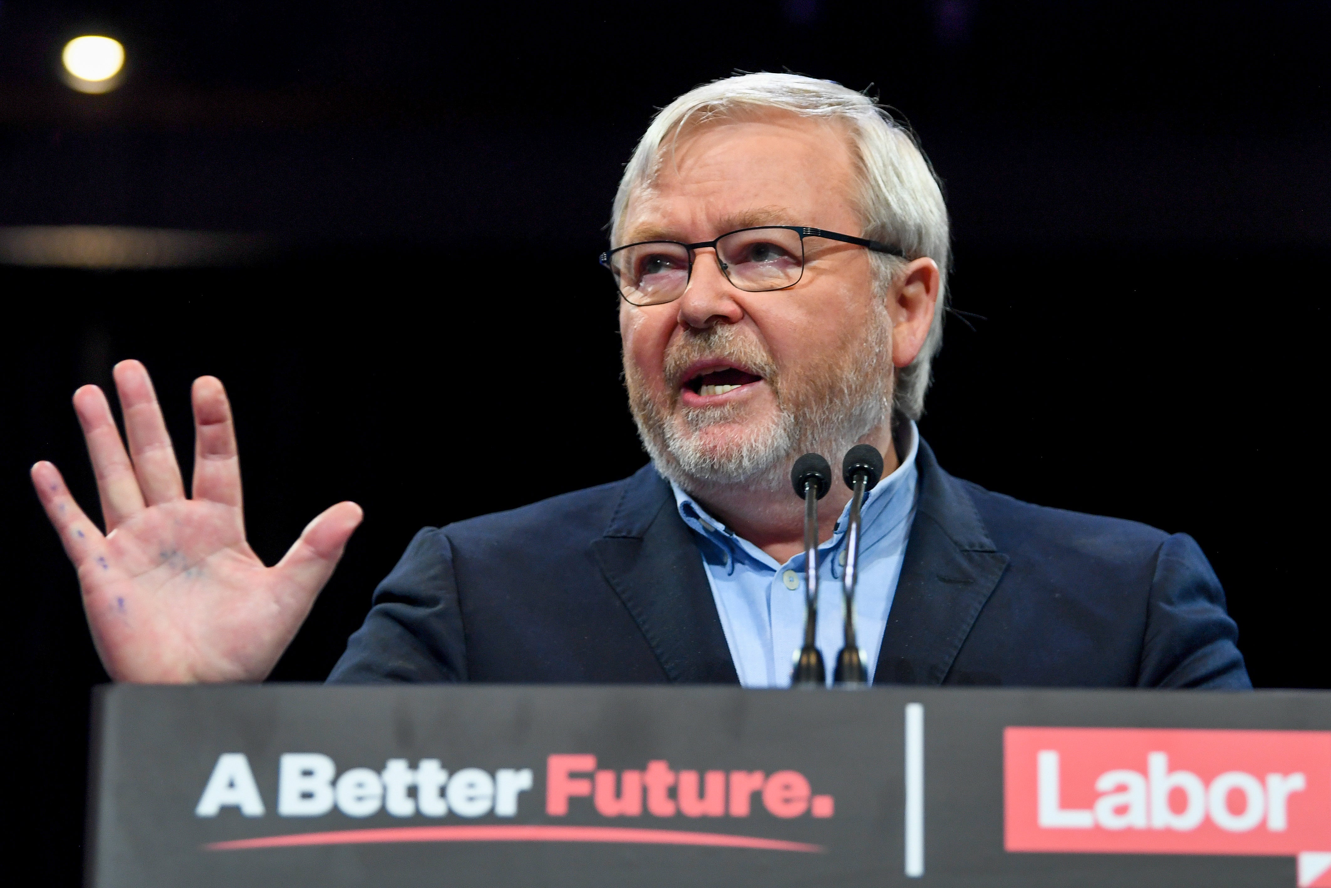 Former Australian Prime Minister Kevin Rudd gestures at a Labor Party rally during the federal election campaign