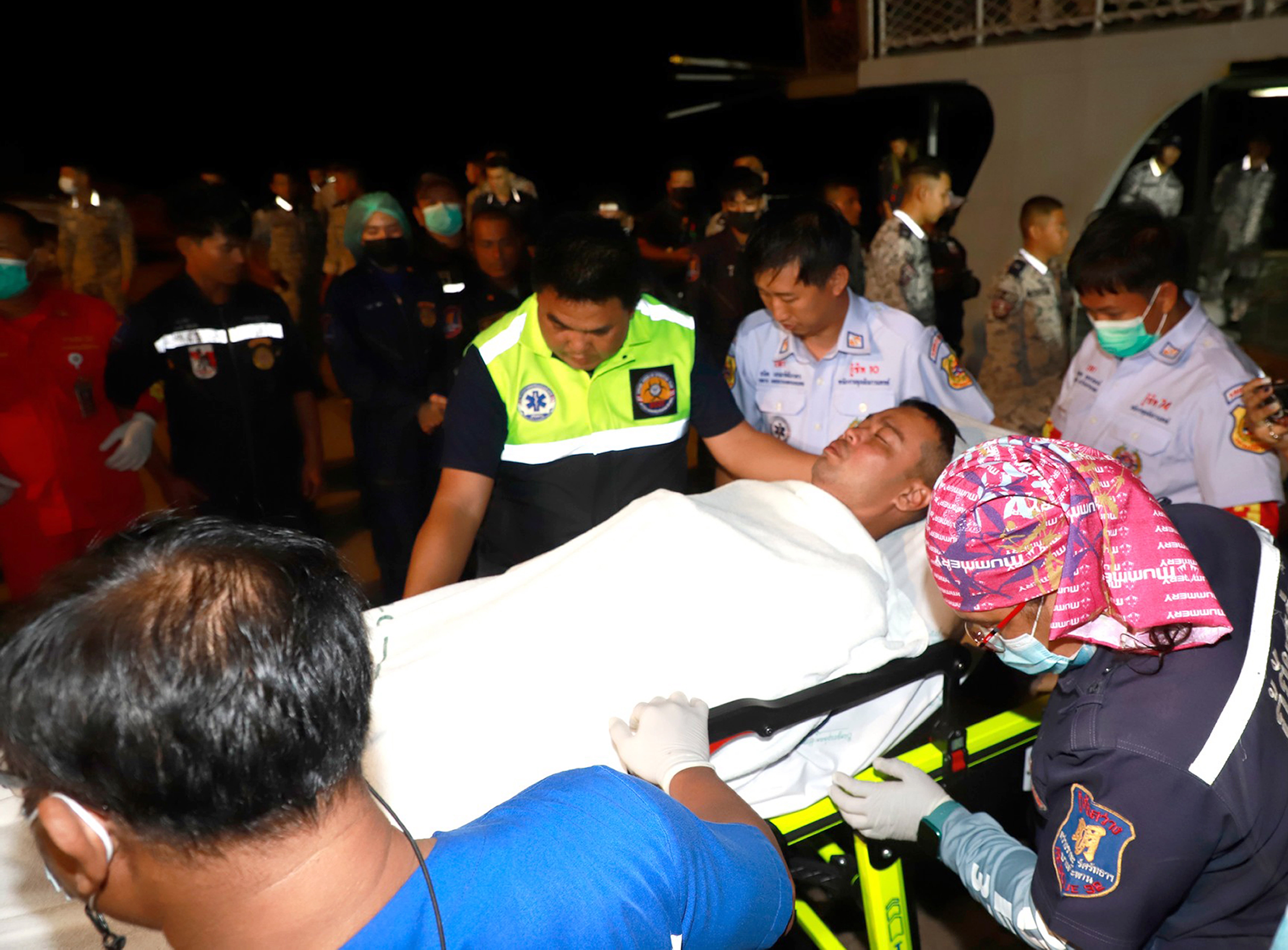 Thai navy personnel and related officers carrying out the rescue of the Royal Thai Navy Sukhothai crew after the ship capsized