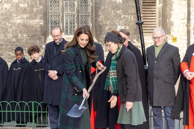 Kate plants a tree in memory of the Queen at Westminster Abbey (PA)