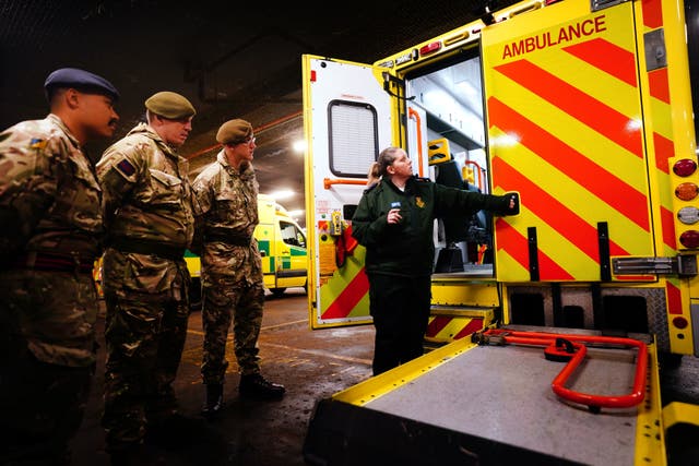 <p>Military personnel at Wellington Barracks as they prepare to provide cover for ambulance drivers </p>