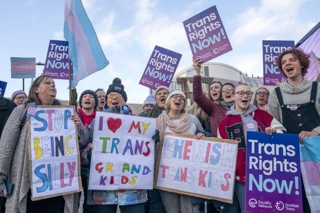 Supporters of the Gender Recognition Reform Bill (Scotland) take part in a protest outside the Scottish Parliament, Edinburgh, ahead of a debate on the Bill (Jane Barlow/PA)