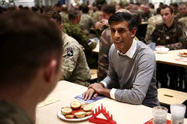 Prime Minister Rishi Sunak eats Christmas dinner with troops at the Tapa military base, in Tapa, Estonia (Henry Nicholls/PA)