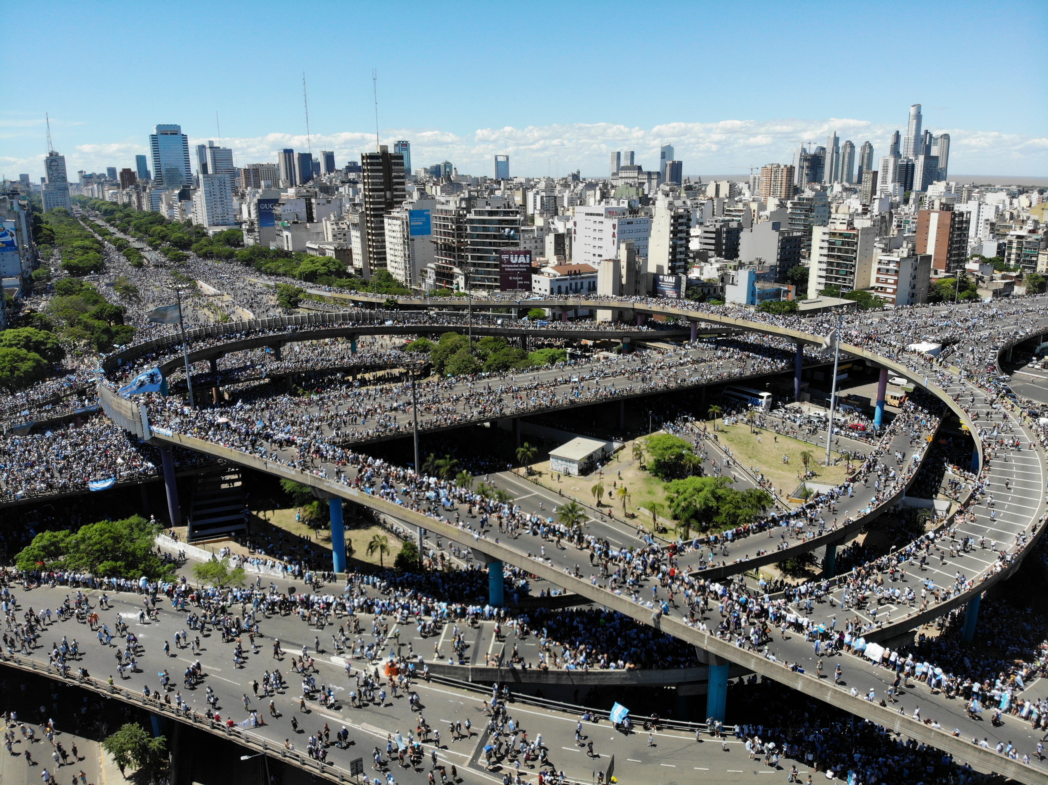 Argentina fans converge on highways during the homecoming parade on Tuesday