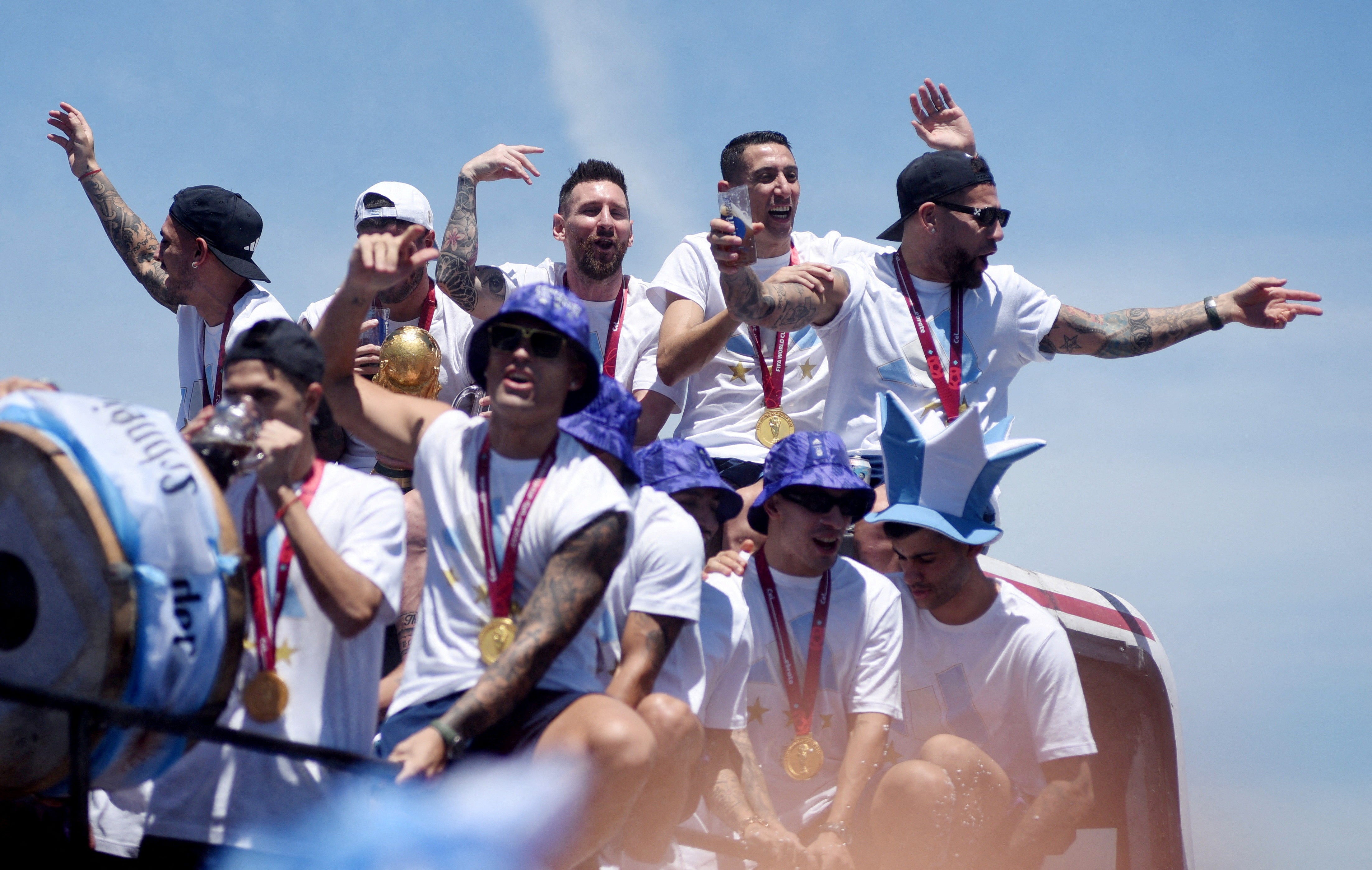 Lionel Messi and teammates celebrate on the bus before being forced to abandon the parade