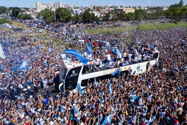 <p>Argentina’s World Cup winners during their homecoming parade in Buenos Aires (Rodrigo Abd/AP)</p>