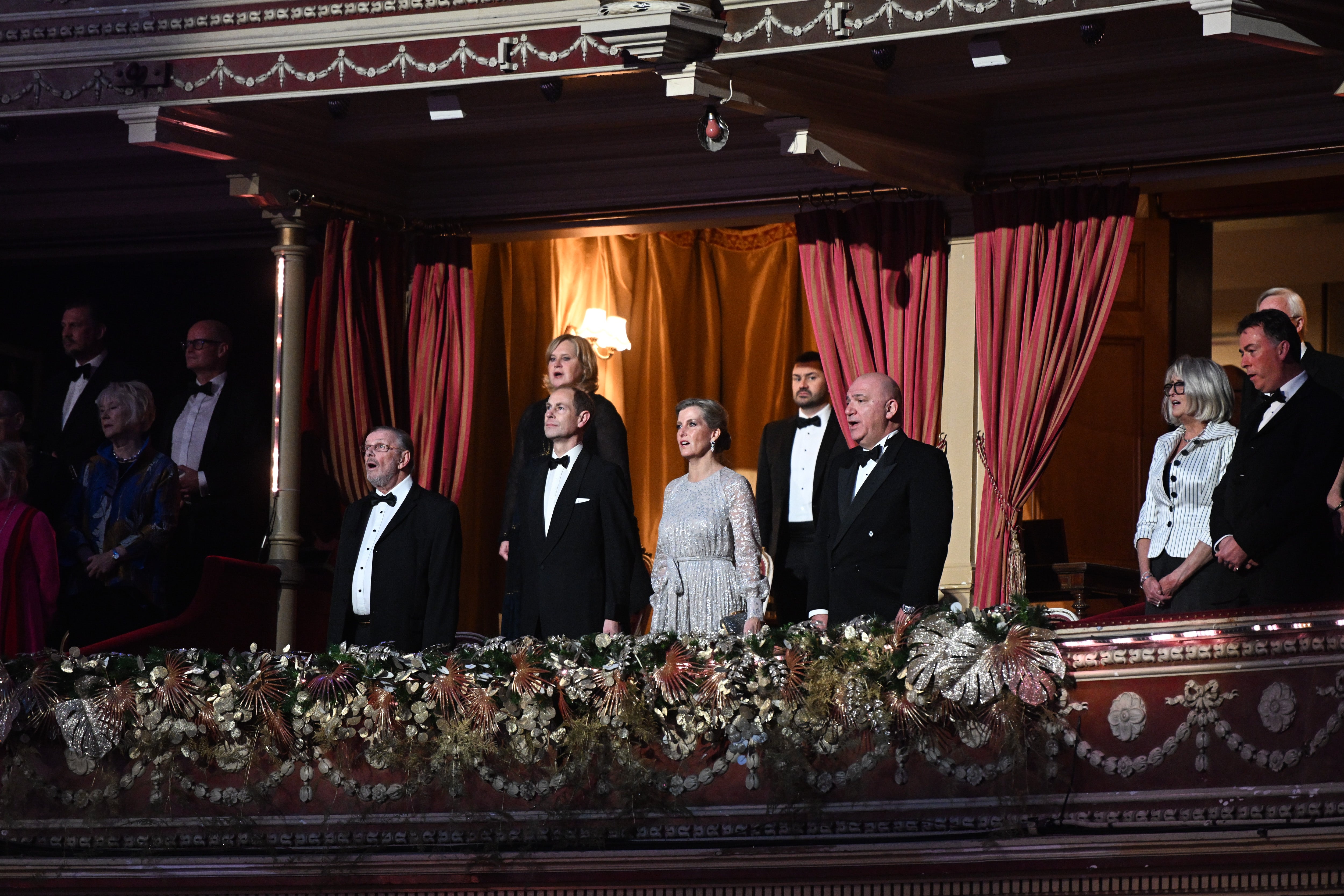 Prince Edward and Countess Sophie (centre) stand during the national anthem