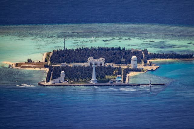 <p>Buildings and structures are seen on the artificial island built by China in Cuarteron Reef on 25 October 2022 in Spratly Islands, South China Sea</p>