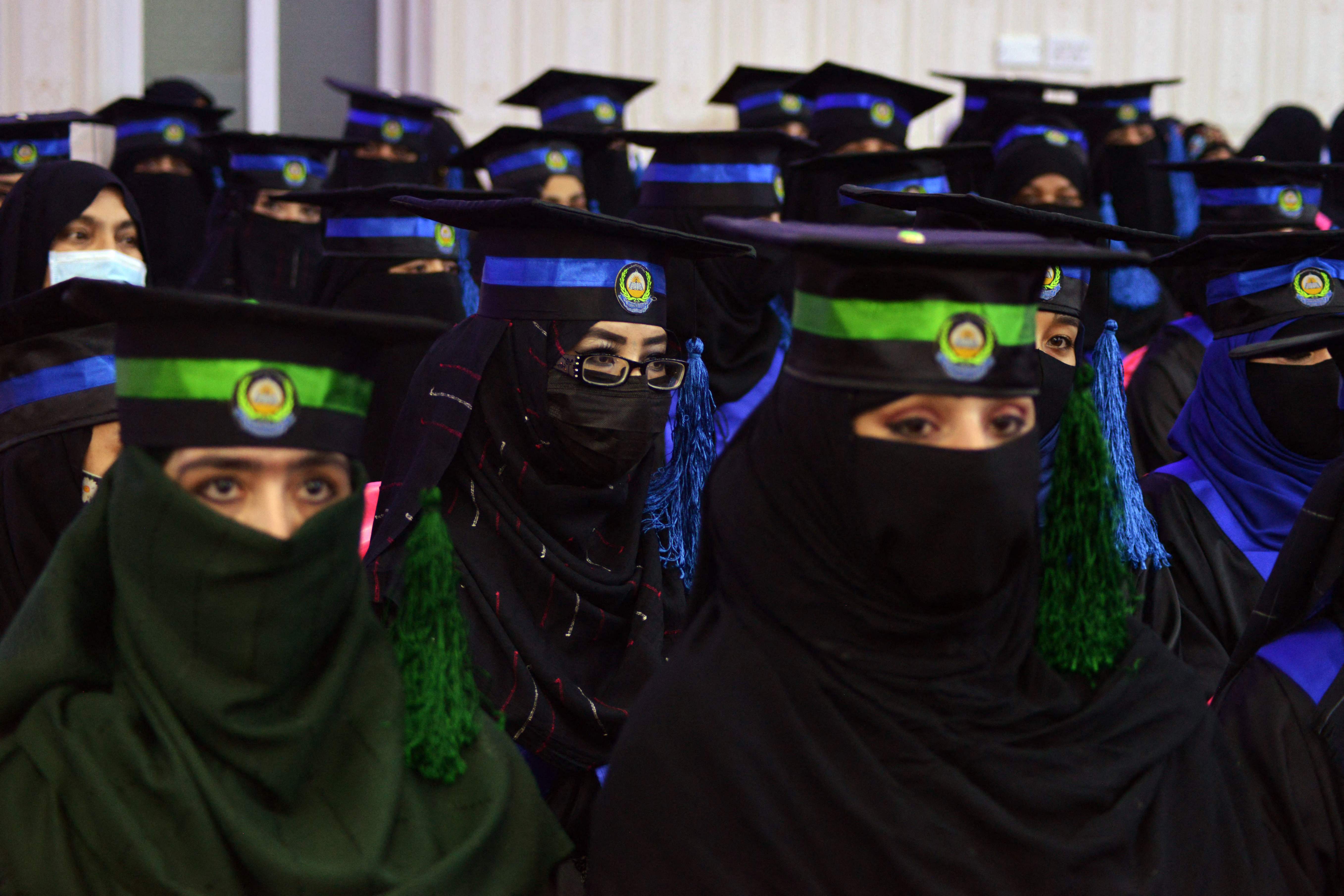 In this file photo taken on 17 March 2022, students from the faculties of Engineering and Computer Science attend their graduation ceremony at Benawa University in Kandahar