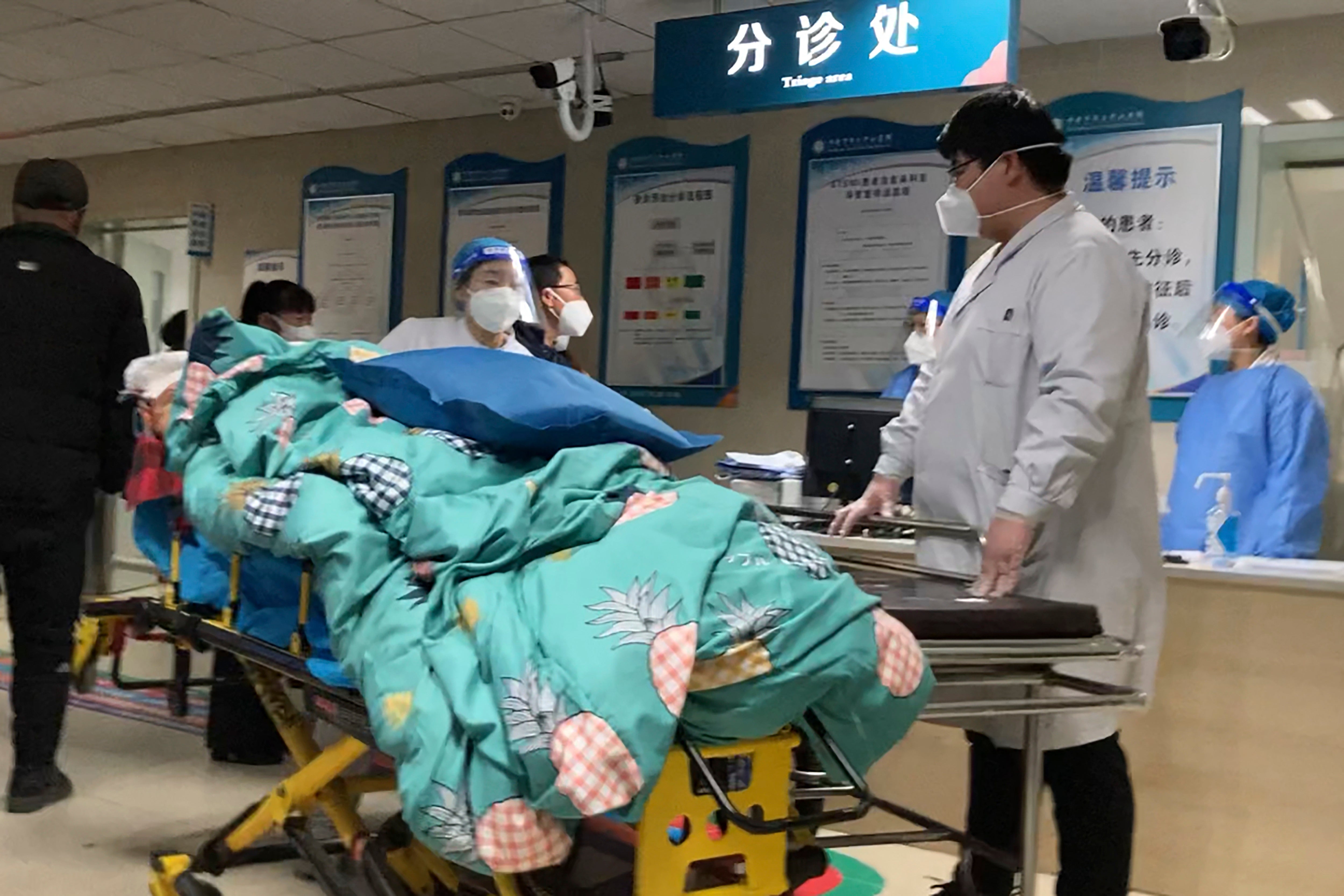 A patient is turned away from a full emergency unit in Zhuozhou, northern China, on Wednesday