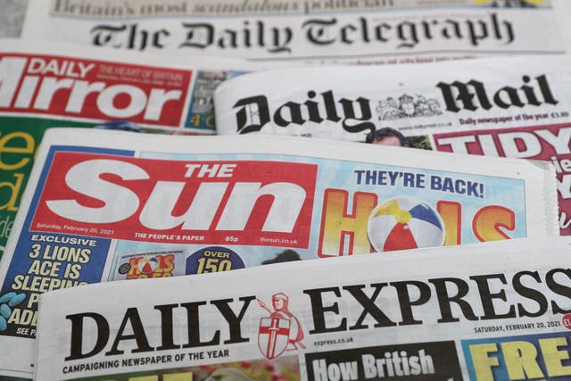A stock image of a pile of newspapers (PA)