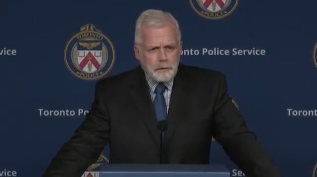 Detective Sergeant Terry Browne addresses reporters at a press conference after eight teens were charged in the death of a 59-year-old Toronto man
