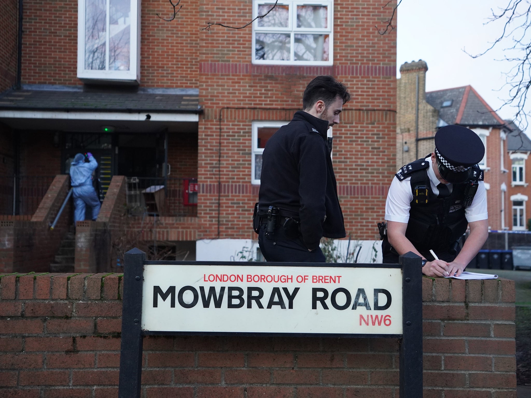 Police officers at the scene in Mowbray Road, Kilburn, after a man