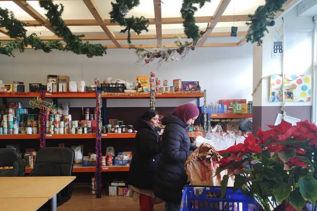 <p>Families continue to get help at a foodbank in west London as Christmas approaches</p>