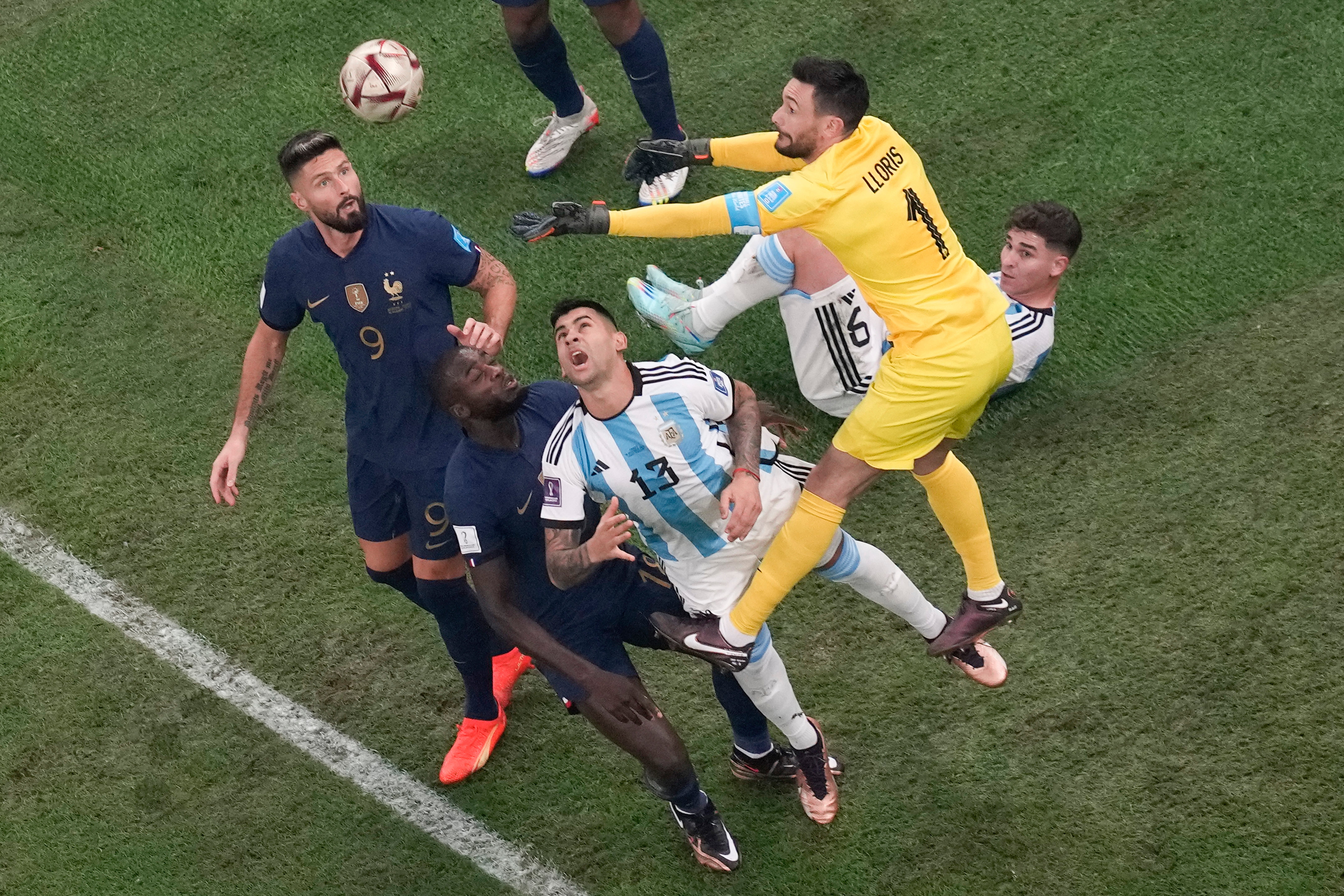 Tottenham’s Hugo Lloris (top right) and Cristian Romero (centre) reached the World Cup final along with Julian Alvarez (on ground)(Thanassis Stavrakis/AP)